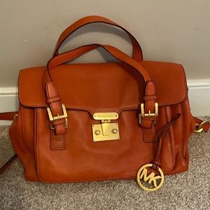 Excellent condition beautiful orange Michael Kors bag.